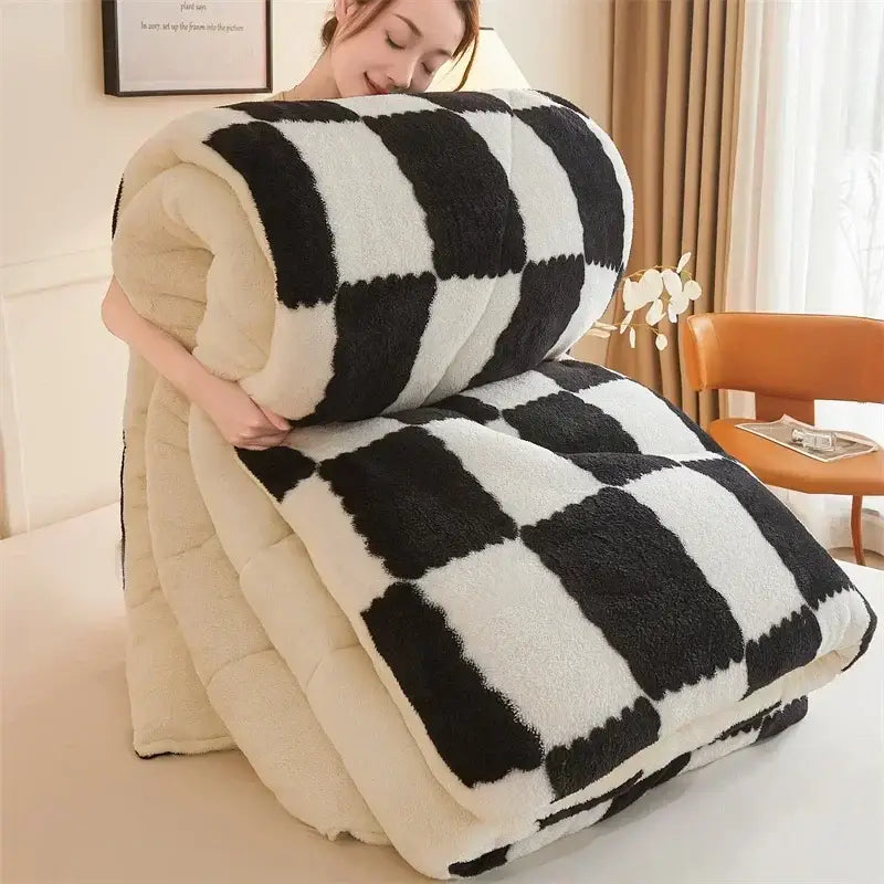 A decorbites cozy checkerboard winter blanket with black and white plush checkered texture and cream fluffy lining