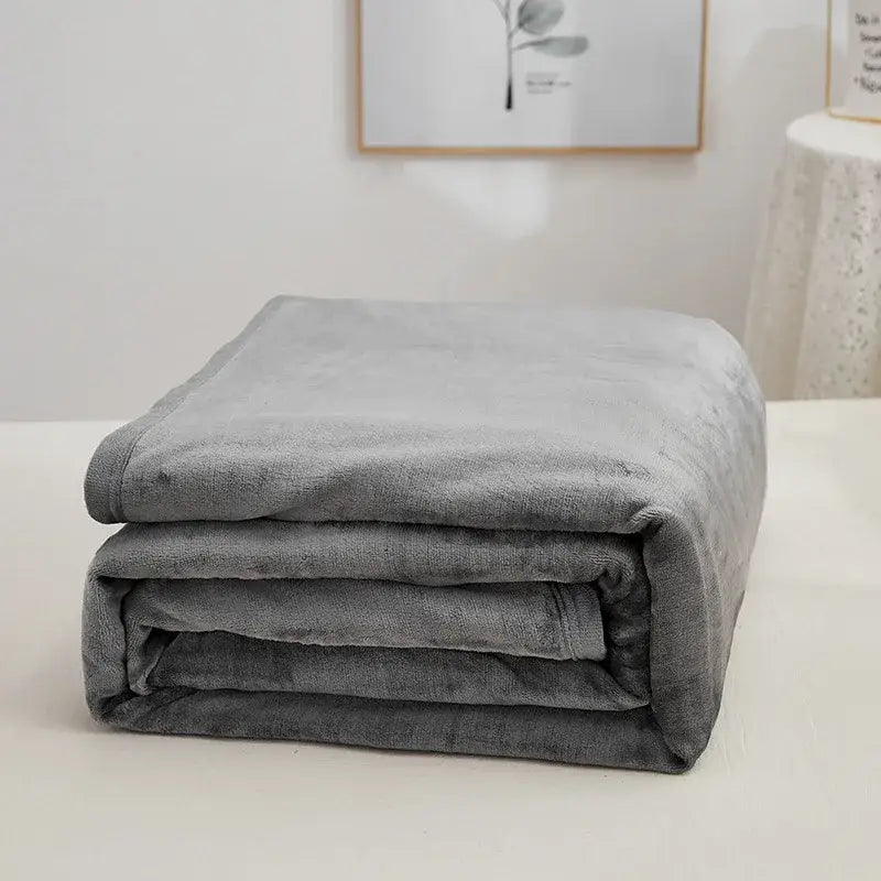 A plush gray decorbites cozy checkered fleece blanket with velvety texture and neatly folded edges for bedroom throw