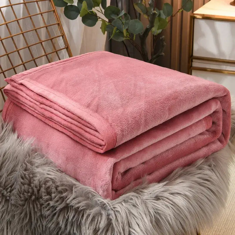 A plush soft pink fleece blanket with a cozy textured surface for decorbites cozy checkered fleece bedroom throw