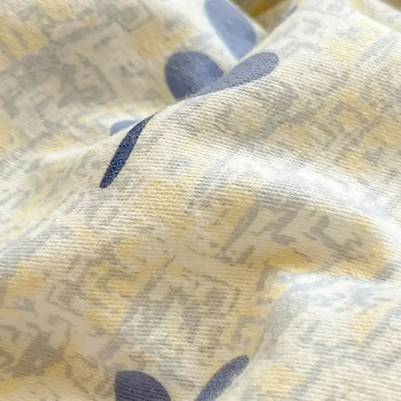 Cream-colored cozy cotton bedding set with subtle blue gray abstract pattern from decorbites cozy cotton collection