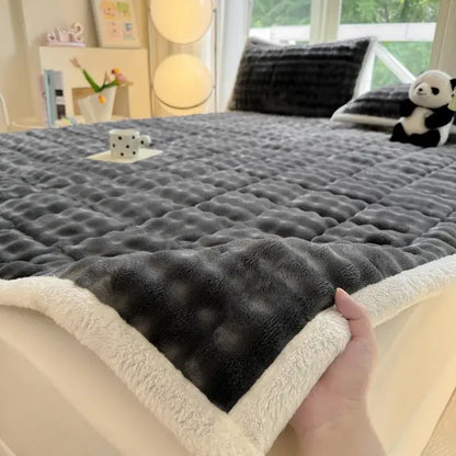 Gray plush quilted bedspread with cream fleece border featuring decorbites cozy faux rabbit fur texture