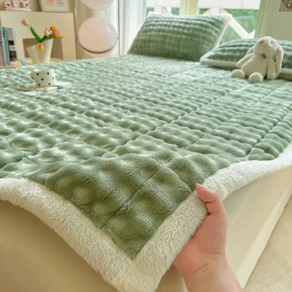 Soft mint green quilted bedspread with plush white fleece border featuring decorbites cozy faux rabbit fur design