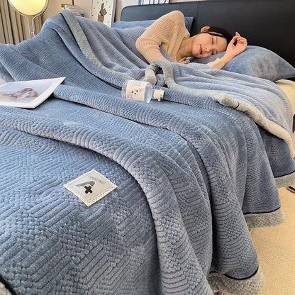 Soft blue cozy jacquard plush blanket with quilted texture and light gray fleece trim for decorbites cozy jacquard throw