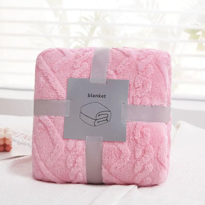 A soft pink decorbites cozy jacquard plush blanket with a textured fluffy surface for living room decor and sofa throws