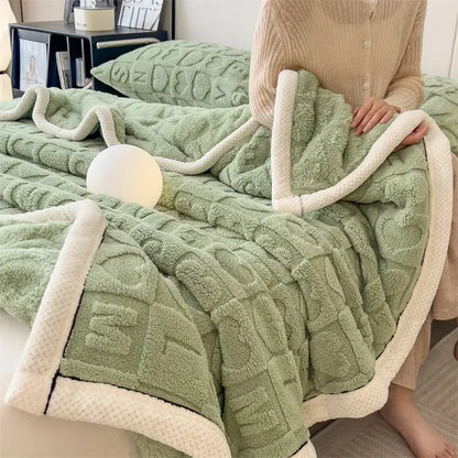 Cozy jacquard taffeta flannel nap blanket featuring a soft mint green fleece with textured knit and cream sherpa trim