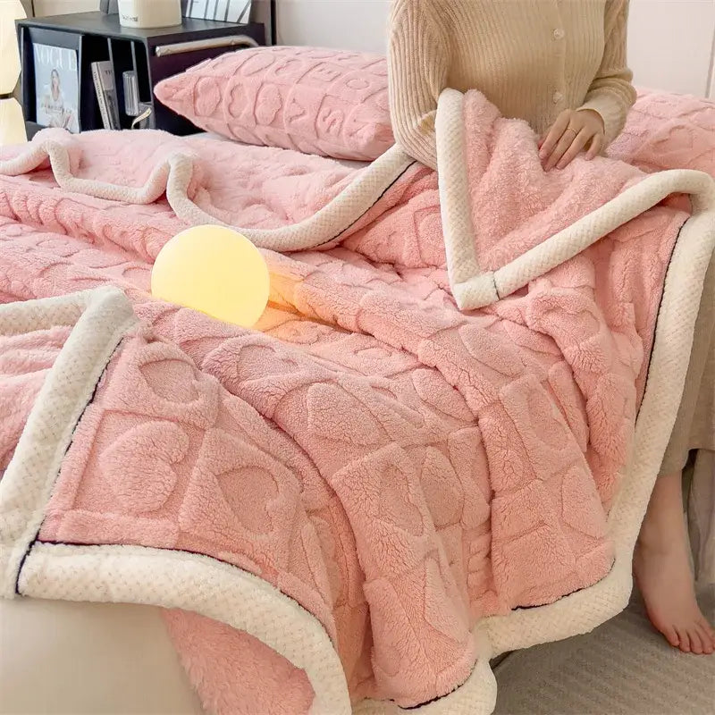 Pink plush quilt with textured heart pattern and cream fleece border for cozy jacquard taffeta flannel nap blanket decorbites