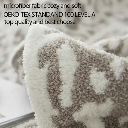 A plush cream and beige microfiber blanket with cozy textured pattern from decorbites cozy leopard print knitted collection