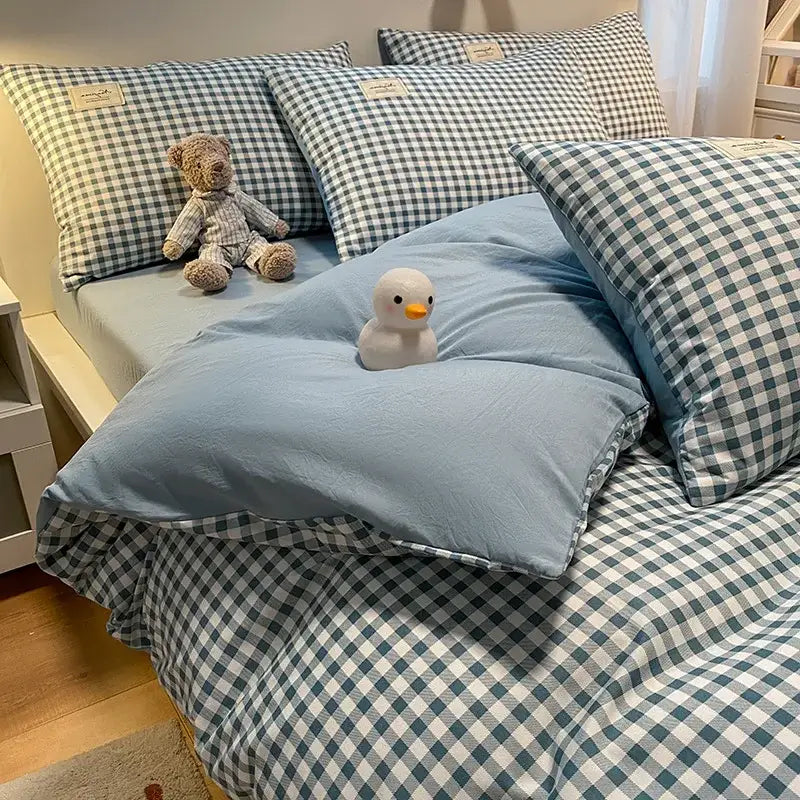 Blue checkered cozy plaid duvet cover with matching pillows and plush duck toy for bedroom decorbites cozy plaid set