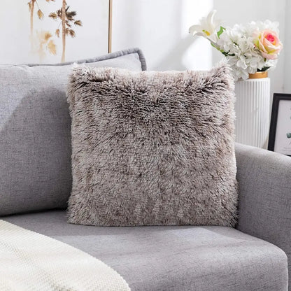 A gray cozy plush fur cushion cover with soft shaggy texture on a modern sofa for decorbites cozy plush decor