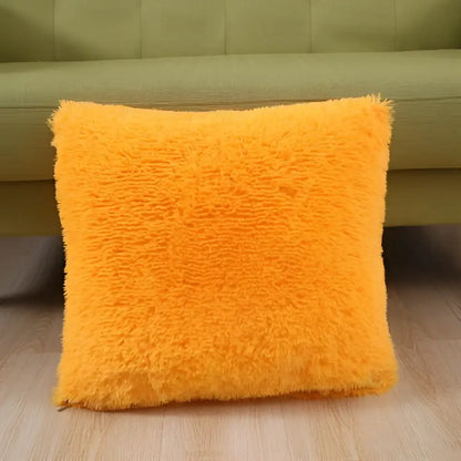 Vibrant orange cozy plush fur throw pillow with shaggy texture suitable as a decorbites cozy plush cushion cover