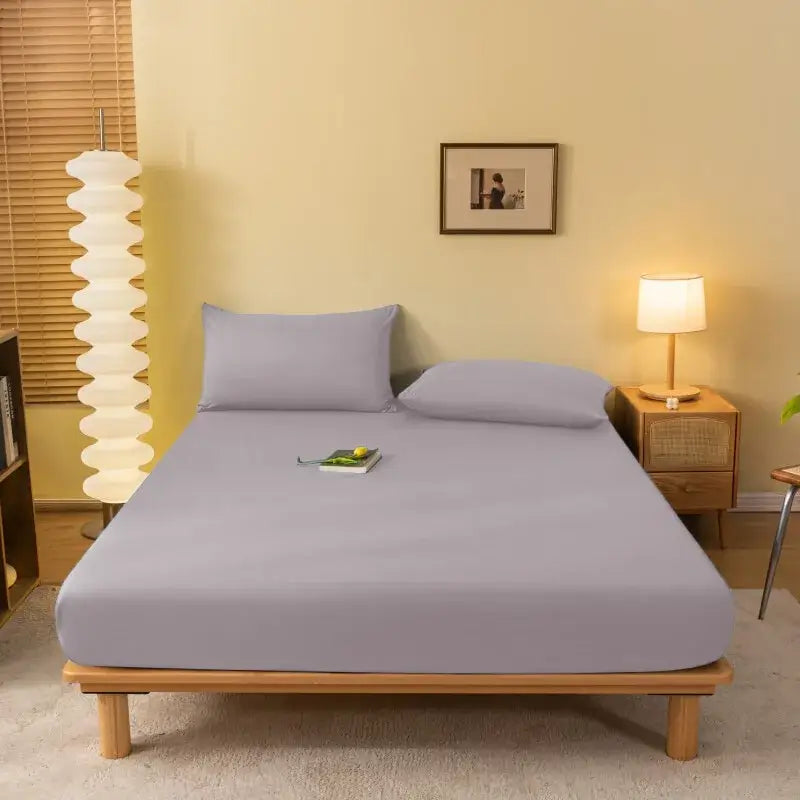 Soft lavender fitted sheet made of smooth stretchy fabric snugly covers the bed by decorbites cozy solid color
