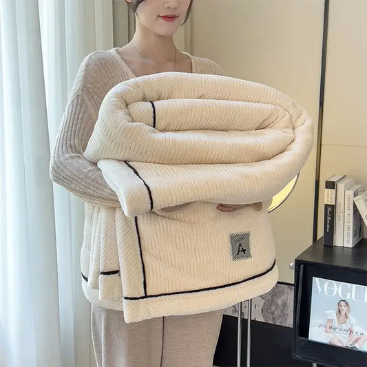 Cream-colored plush cozy striped knitted velvet bedroom blanket with black trim and small embroidered patch