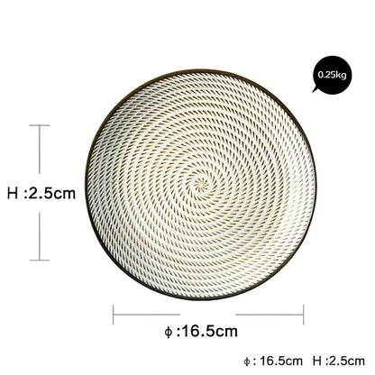 Circular light gray woven tray with spiral pattern and black rim paired with decorbites ceramic dinner plate set