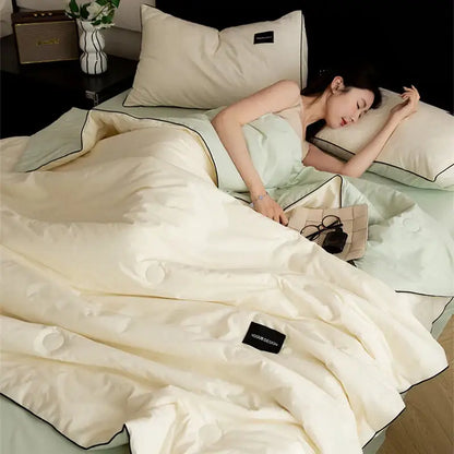 Cream and black ice cream cool feel summer quilt bedroom set with cream-colored quilted duvet and black piping decorbites ice cream
