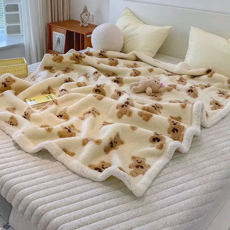 Cream and brown bear lamb plush blanket with cream-colored soft fleece and fuzzy plush blanket texture for bedroom use