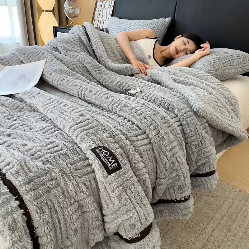 Gray decorbites fluffy fleece blanket with textured geometric pattern black trim and branded label for bedroom decor