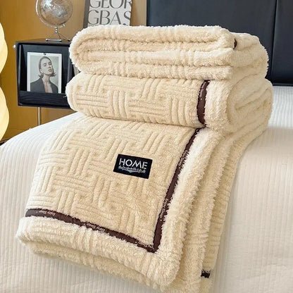 Cream and brown decorbites fluffy fleece blanket with woven geometric pattern and black home label for bedroom decor