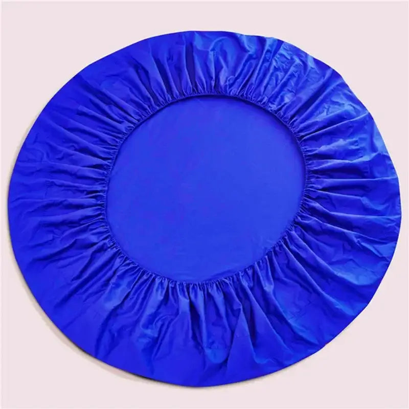 Vibrant royal blue fitted bed sheet with elasticated edges and smooth glossy fabric in a cream and gray bed sheet set