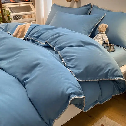 Soft blue quilted bedding set with white zigzag cozy shell edges for decorbites cozy shell bedroom use