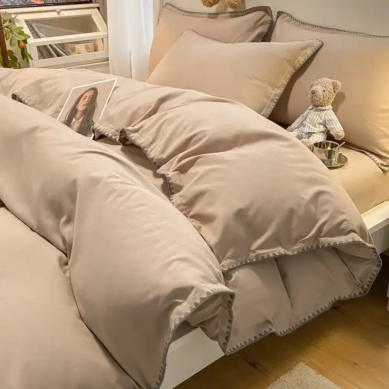 Beige quilted duvet bedding set with subtle stitched edge detail featuring decorbites cozy shell edges design