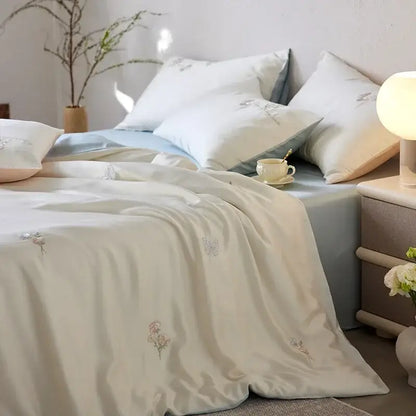 Cream and green cartoon embroidery comforter set with cream satin duvet cover featuring delicate pastel floral embroidery decorbites cartoon embroidery