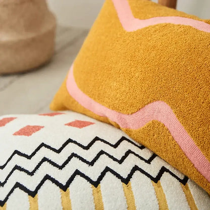 Mustard yellow textured embroidered cushion cover with wavy pink border for living room decor