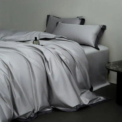 Silver satin duvet cover set with black trim in a cream and lavender egyptian cotton hotel style bedding set bedroom