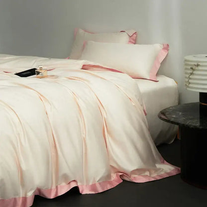 Cream-colored satin duvet cover with pink piping in a cream and lavender egyptian cotton hotel style bedding set