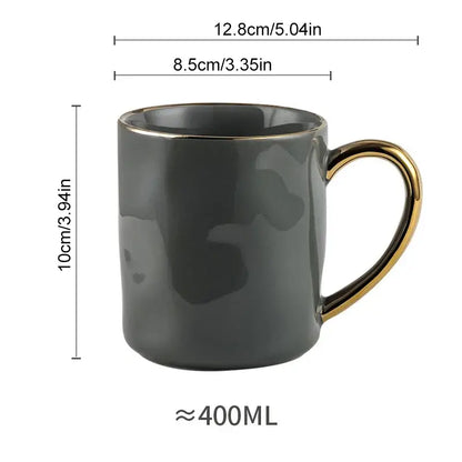 A sleek dark gray ceramic gold rim mug with glossy finish designed for everyday use in a nordic gold rim mug set