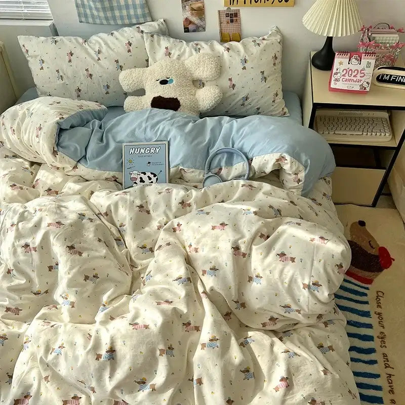 Cream bedding set with decorbites cartoon pattern of dogs in pastel outfits made from soft cotton fabric with pillowcases