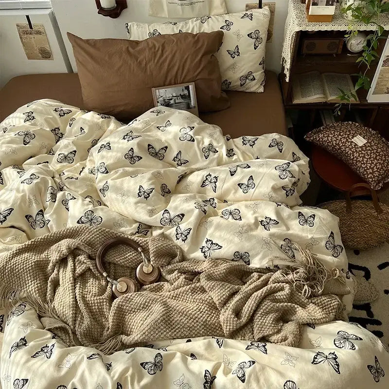 Cream-colored duvet cover with repeating black butterfly pattern soft fabric cozy texture decorbites cartoon pattern printed bedding set