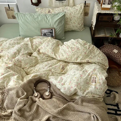 Soft cream-colored bedding set with embroidered bear motifs and muted green pillowcase for decorbites cartoon pattern decor