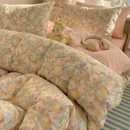 Floral-patterned bedding set in soft pastel yellow pink and blue made of cartoon printed cotton for bedroom decorbites decor