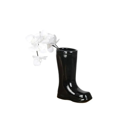 Shiny black decorbites ceramic shoe vase holding white orchids for stylish living room flower decor