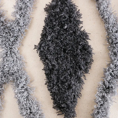 Dark gray fluffy textured fringe trim on cream and charcoal grey geometric tufted cushion cover for living room decorbites decor