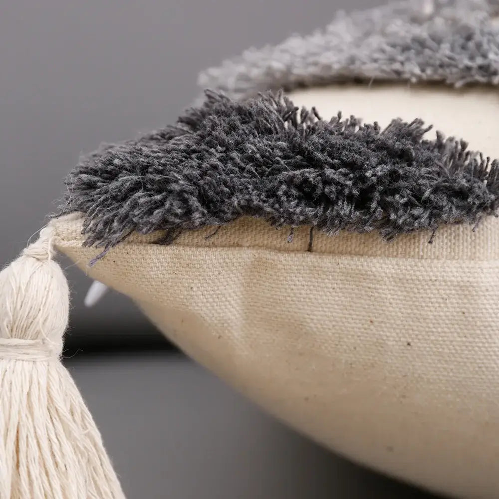 Beige canvas cushion cover with dark gray shaggy fringe and cream tassel for decorbites grey geometric tufted decor