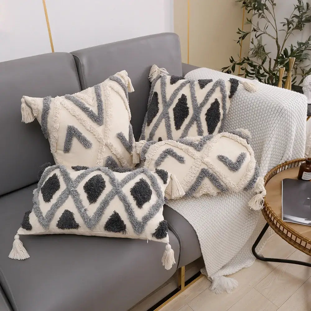 Set of three cream and charcoal grey geometric tufted cushion covers with textured fabric and tassels for living room decorbites decor