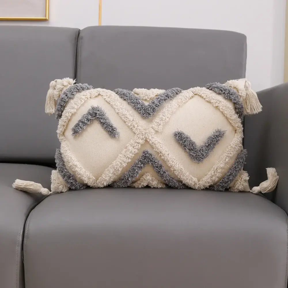 Cream and charcoal grey geometric tufted cushion cover with tassel accents for decorbites grey geometric decor