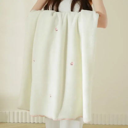 Cream cherry velvet embroidered blanket featuring off-white baby velvet with pink embroidered foxes and trim edges