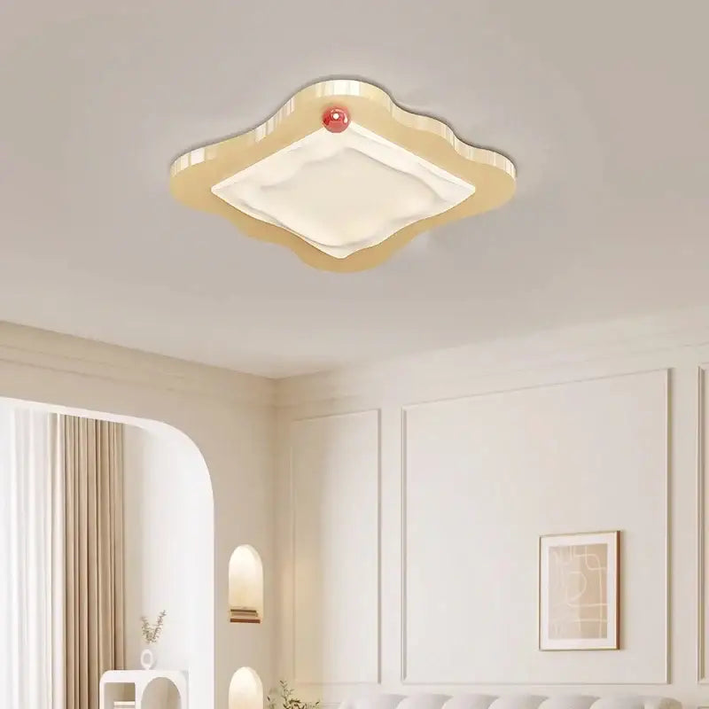 Cream cloud led ceiling light with red accent featuring beige cloud shape white diffuser for bedroom decorbites cream led decor