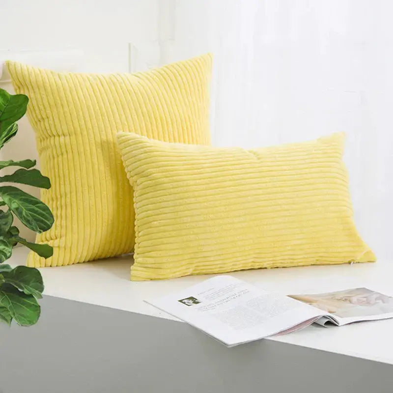 Two vibrant yellow corduroy striped cushion covers with ribbed texture by decorbites for living room decor