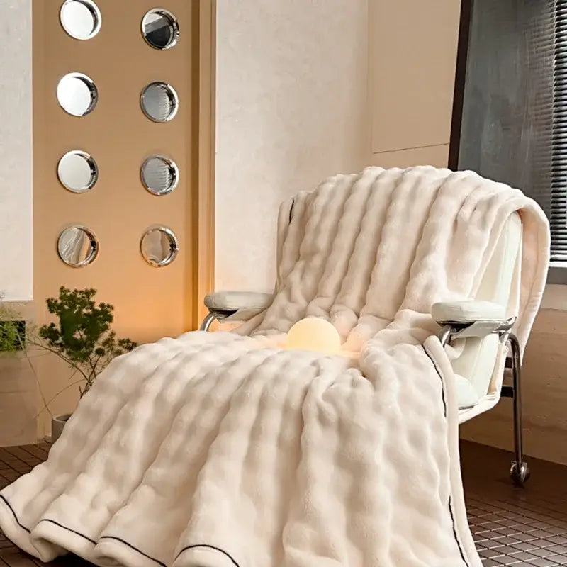 Cream cozy bubble faux rabbit fur blanket with plush ribbed texture and black piping for bedroom decorbites cozy bubble throw
