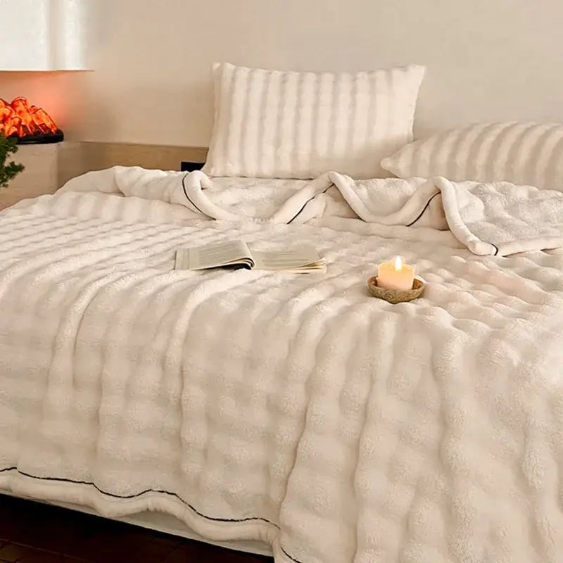 Cream cozy bubble faux rabbit fur blanket with plush quilted texture and subtle black piping for bedroom decorbites cozy bubble