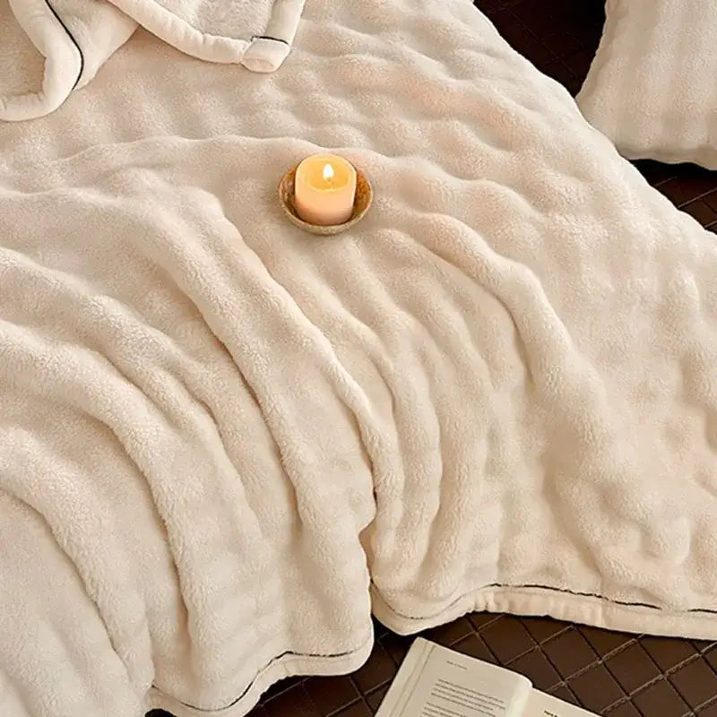 Cream cozy bubble faux rabbit fur blanket with cream waffle texture and subtle black piping for bedroom throw decorbites cozy bubble