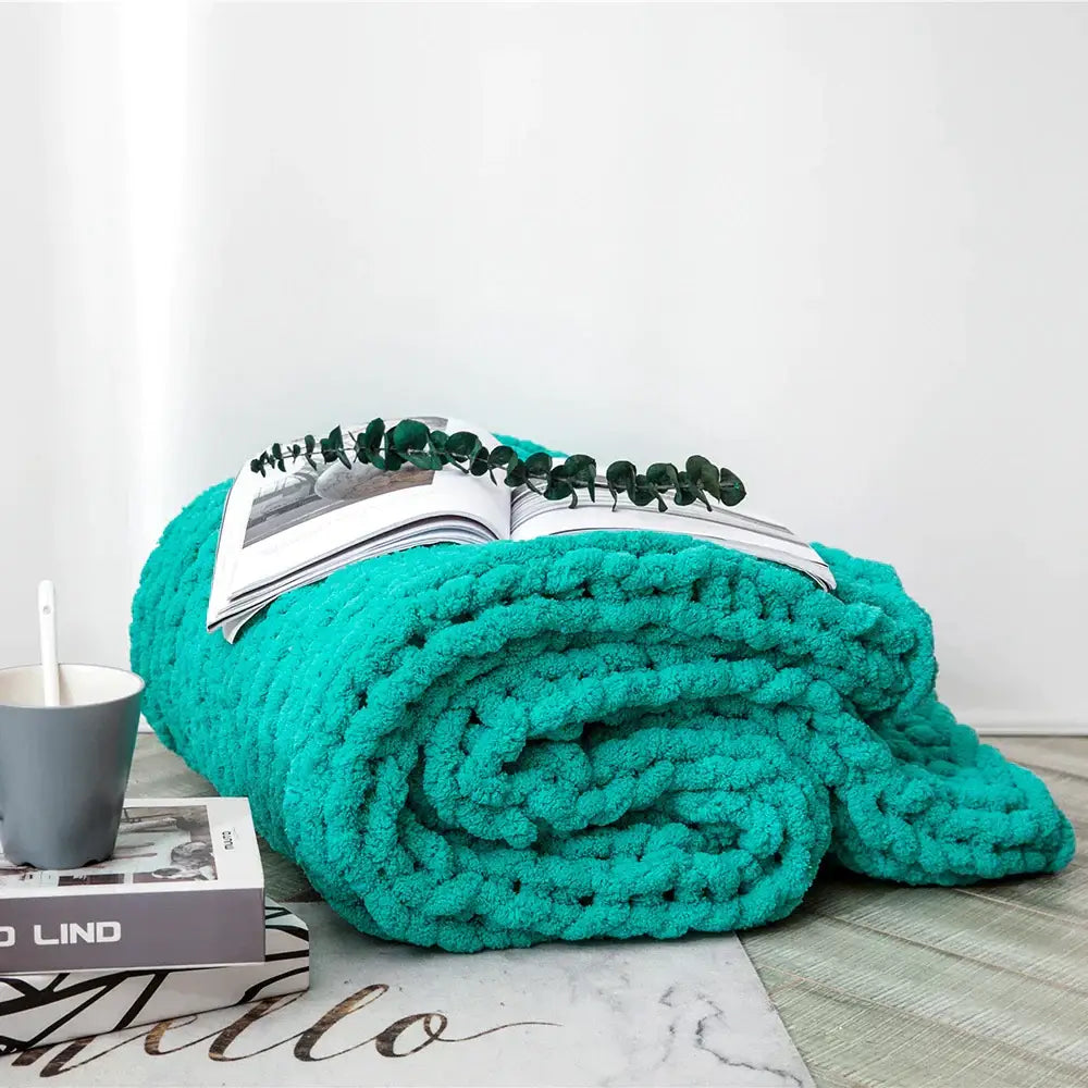 A plush vibrant teal chenille chunky knit throw blanket with cozy textured surface perfect for bedroom decorbites cozy chenille