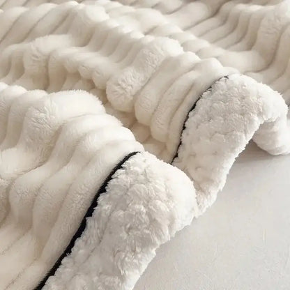 Cream cozy decorbites plush blanket with ribbed texture black piping edge made of cozy faux rabbit fur