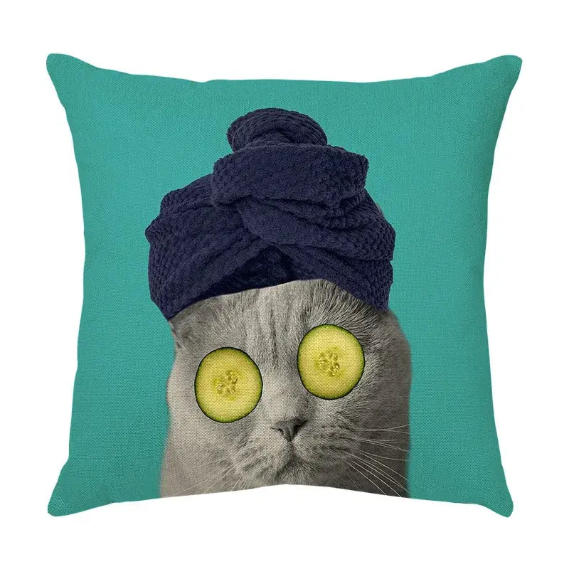 Teal throw pillow with a cute cat face decorative cover featuring a gray cat with cucumber eyes and navy towel turban