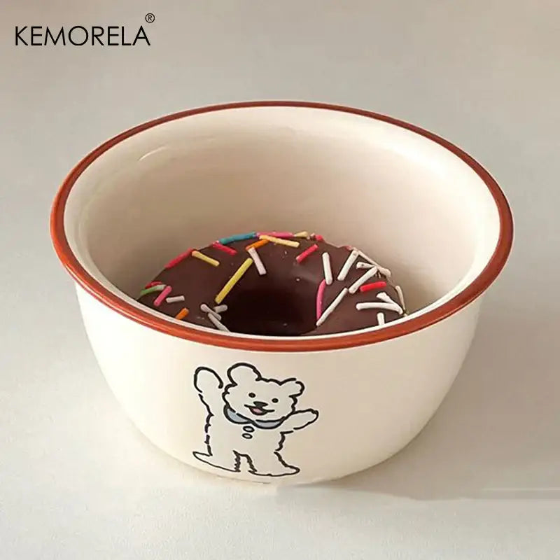 White ceramic soup bowl with a brown rim and a black bear illustration holding a chocolate donut decorbites carton ceramic
