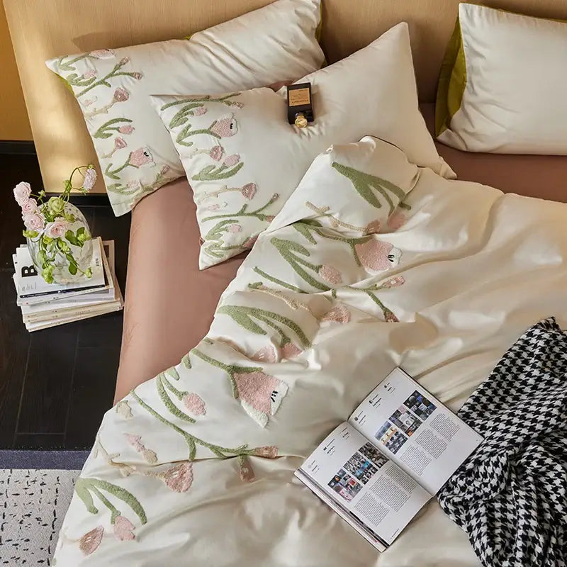 Cream egyptian cotton bedding set with cream satin duvet cover featuring delicate pink and green tulip embroidery