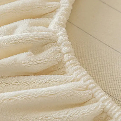 Cream embroidered cozy velvet fitted sheet with a cream plush textured surface and ribbed edge for bedroom use